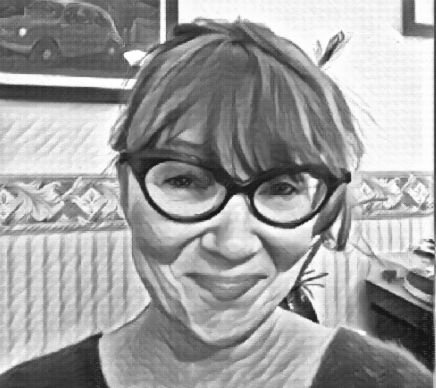 Nimetön malli man and woman laughing while sitting in front of laptops